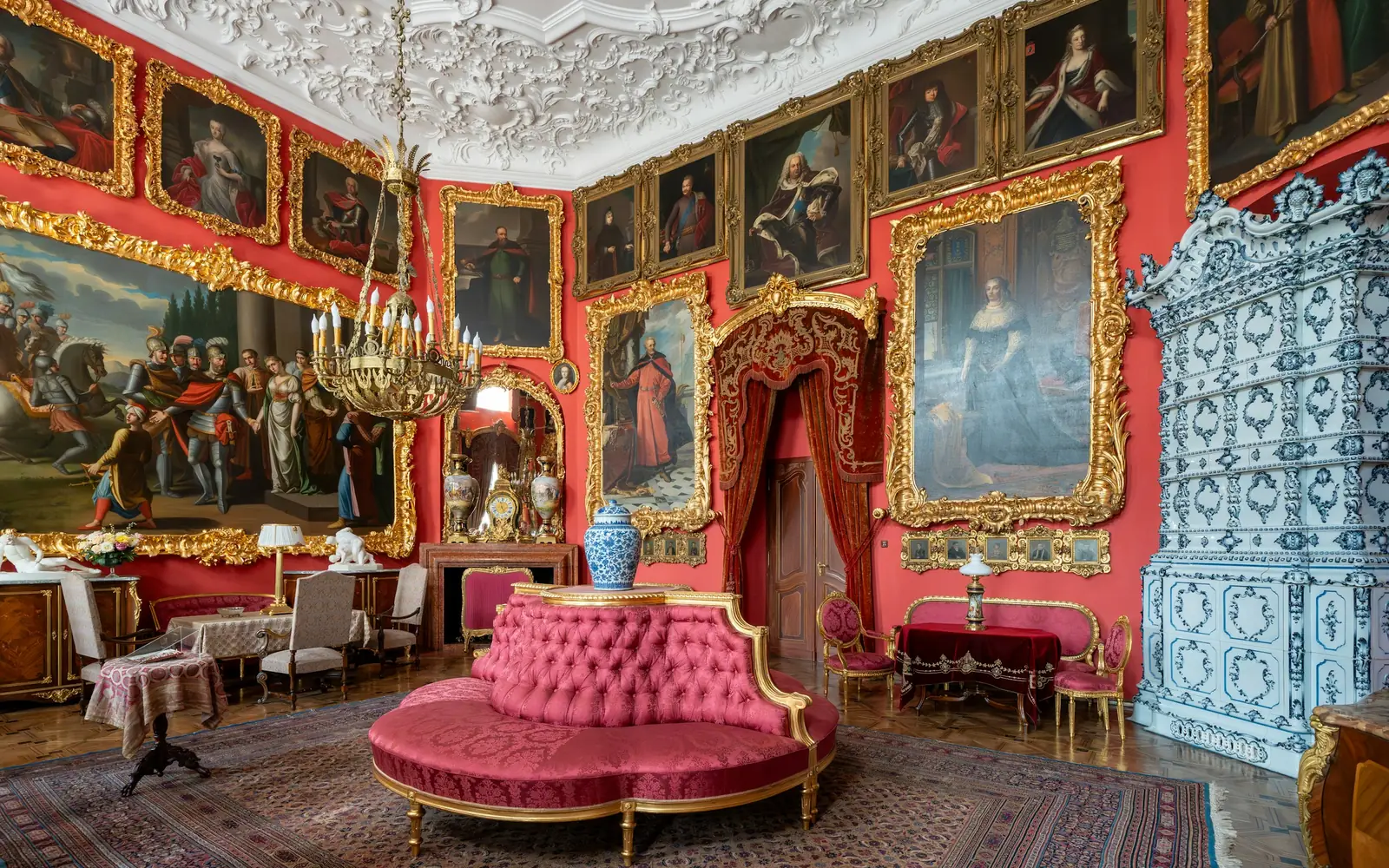 A richly painted room of the Royal Private Apartments at Wawel hung with paintings