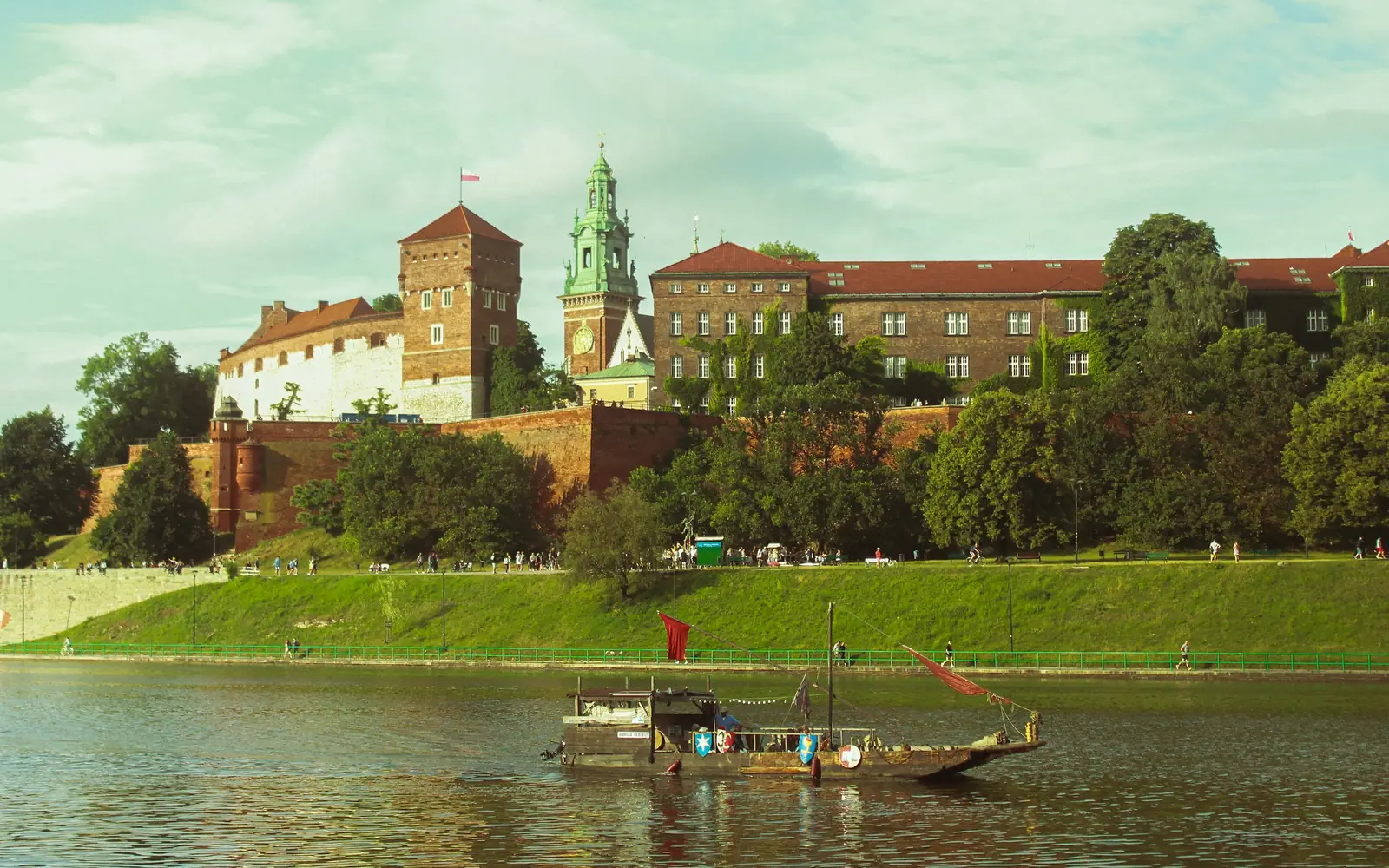 A river boat on the Vistula passing beneath the walls of Wawel Hill